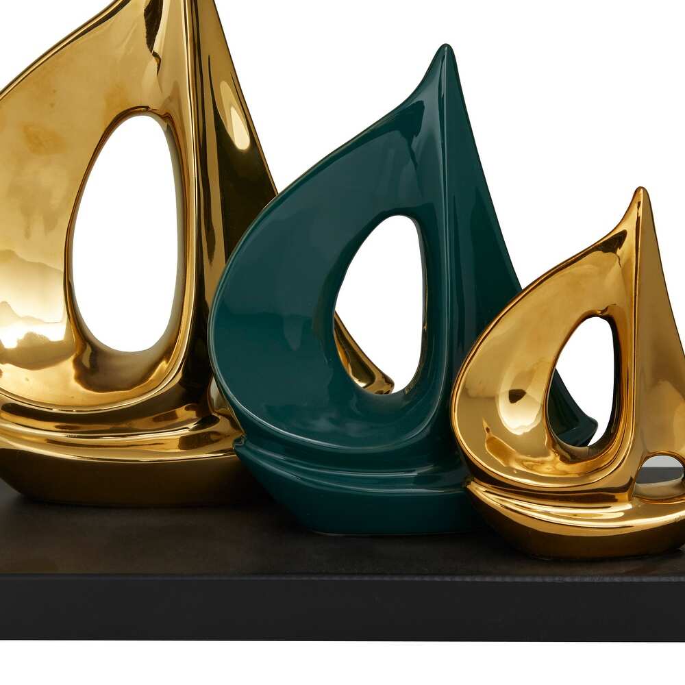 CosmoLiving by Cosmopolitan Gold Polystone Sail Boat Sculpture with Black Base   5.15 x 12.15 x 9.75