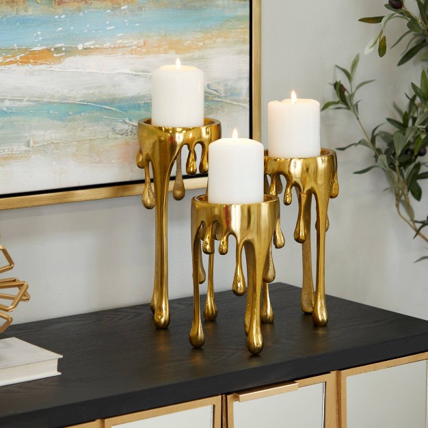 Aluminum Abstract Pillar Drip Set Of 3 Gold Candle Holder Cosmoliving By Cosmopolitan