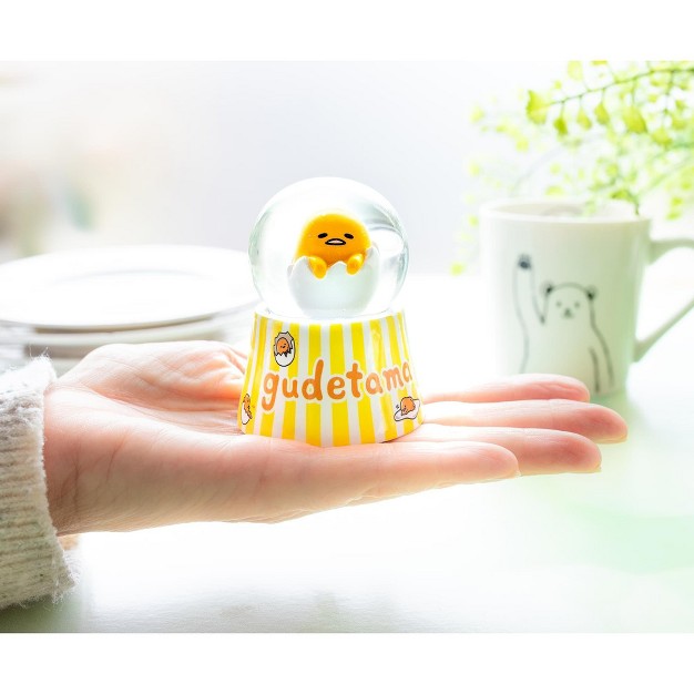 Silver Buffalo Sanrio Gudetama Mini Light up Snow Globe 2 5 Inches Tall