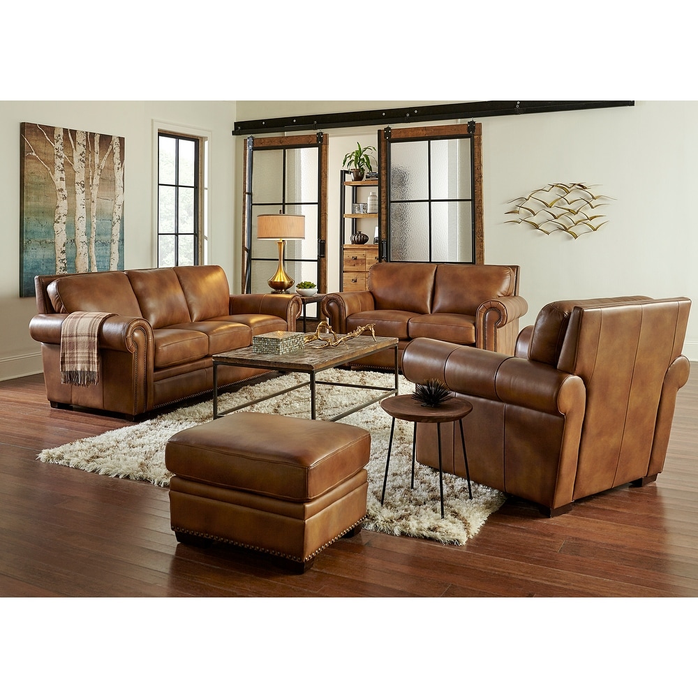 Padagona Four Piece Leather Sofa  Loveseat  Chair and Ottoman Set