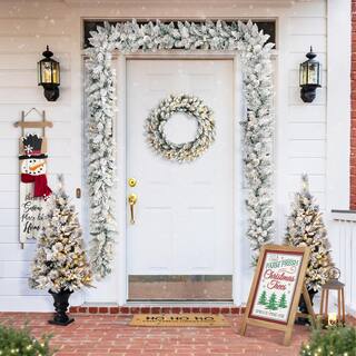 2-Pack 9 ft. Pre-lit LED Artificial Christmas Garland and 24 in. D Pre-lit Snow Flocked Christmas Wreath Set GH2016000005