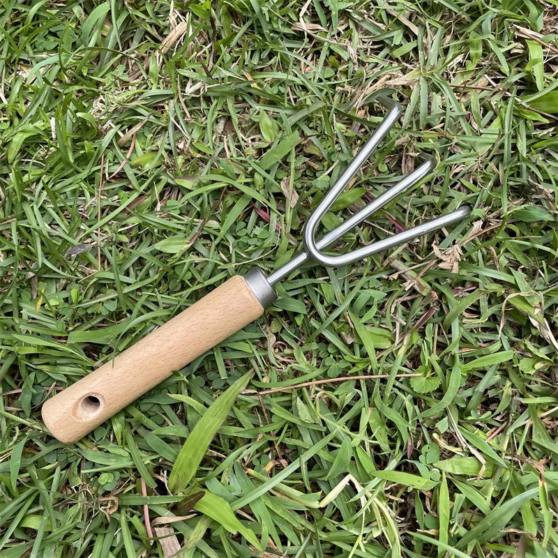 Hot sale Stainless Steel Head Wood Handle Garden Rake Small Garden Hand Tool Cultivator Planting Garden Steel Rake