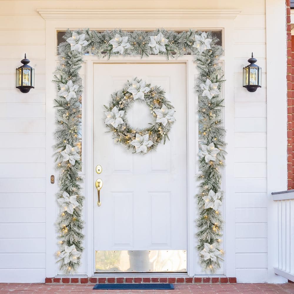 9 ft. Pre-Lit Snow Flocked Greenery Pine Poinsettia Artificial Christmas Garland with 50 Warm White Lights with Timer 2016000017