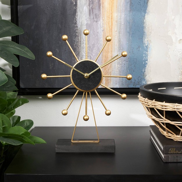 Metal Sunburst Clock With Black Base And Clockface Gold Cosmoliving By Cosmopolitan