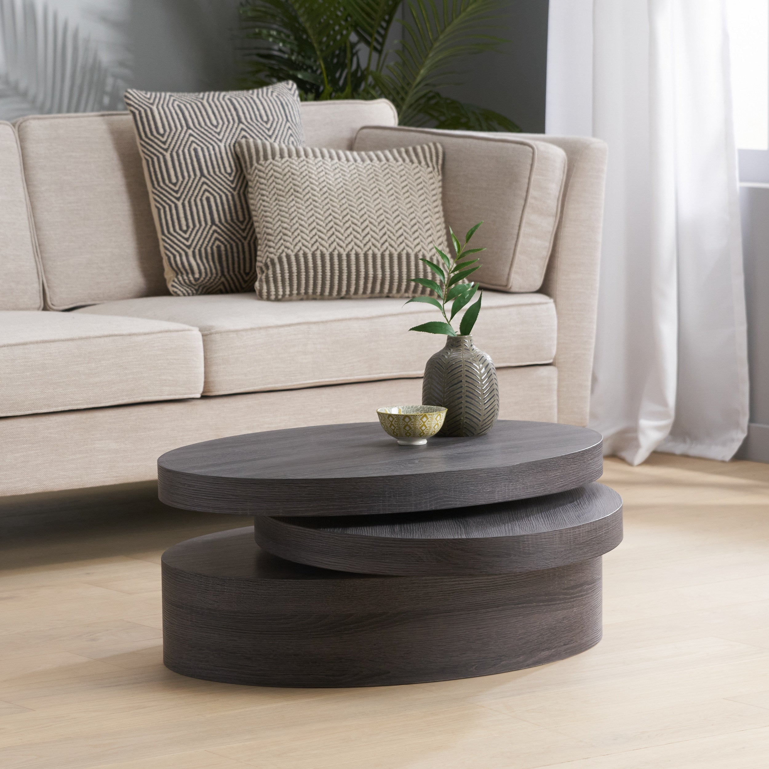 Lenox Modern Oval Black Oak Finish Faux Wood Rotating Coffee Table