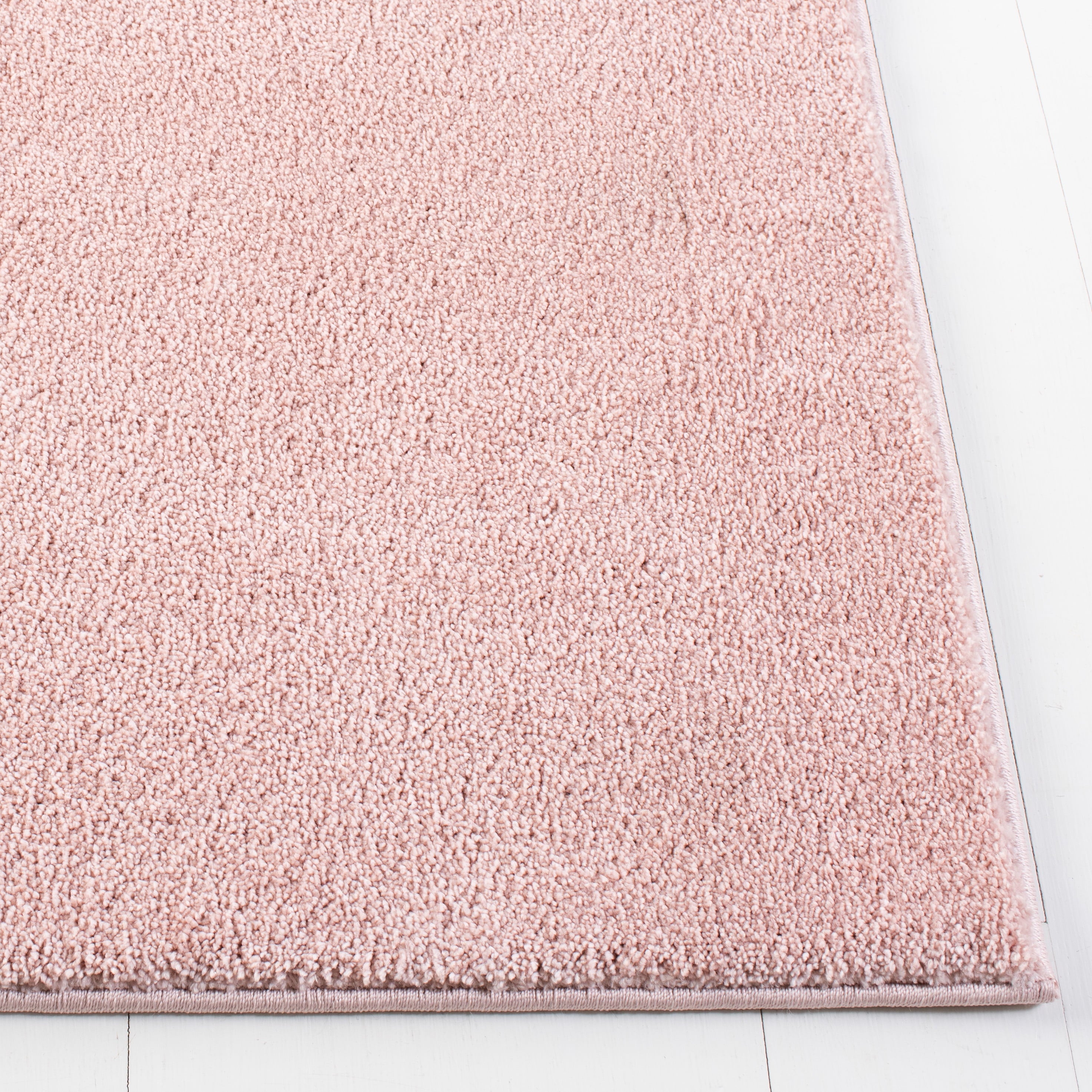 SAFAVIEH Plain and Solid Carleen Solid Plush Area Rug, Pink, 5'5