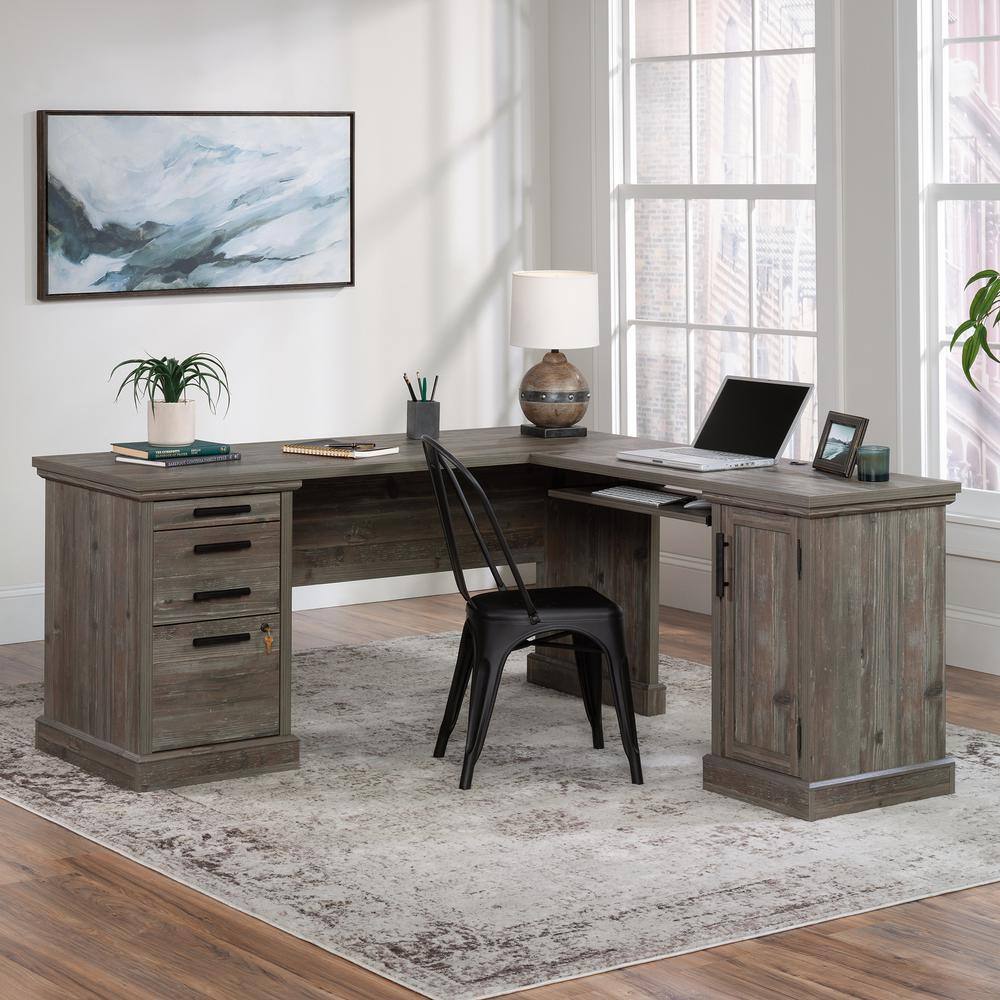 SAUDER Aspen Post 65.118 in. L-Shaped Pebble Pine 3-Drawer Computer Desk with Keyboard Shelf and Cord Management 433686