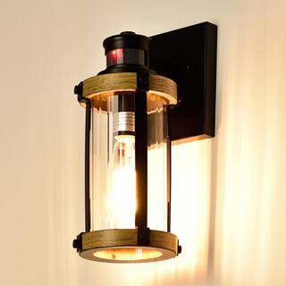 C Cattleya 1-Light Black and Woodgrain Motion Sensing Dusk to Dawn Outdoor Wall Sconce with Striped Clear Glass CA1930-W