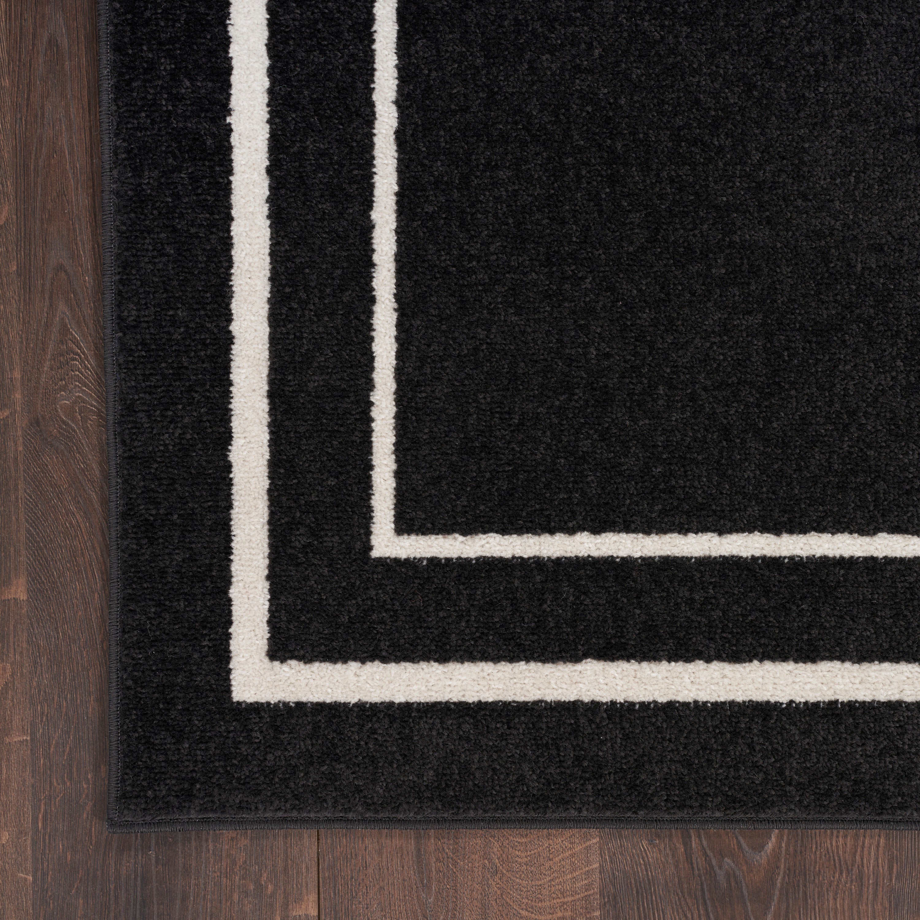 Nourison Essentials Black Ivory Rug