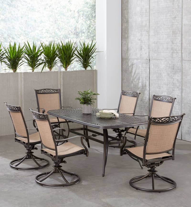 Hanover Fontana 7-Piece Outdoor Dining Set In Tan/Bronze With 6 Sling Swivel Rockers and 38and#215;72 Cast Table