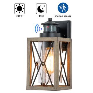 C Cattleya 1-Light Black and Faux Wood Motion Sensing Dusk to Dawn Outdoor Wall Lantern Sconce with Clear Seeded Glass CA2200-W