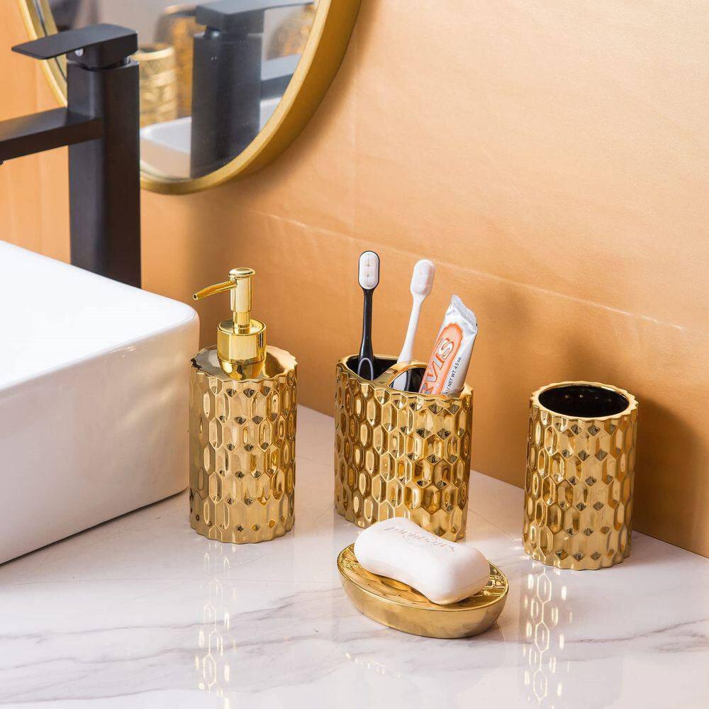 Dracelo 4-Piece Bathroom Accessory Set with Toothbrush Cup Soap Dispenser Soap Dish Tumbler in Gold B09YC7P61W