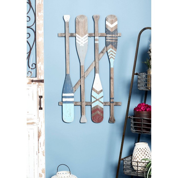 Coastal Wood Paddle Wall Decor With Arrow And Stripe Patterns Olivia amp May