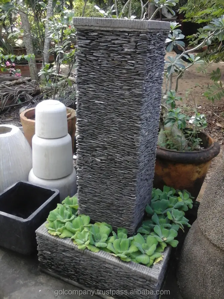 Terrazzo feature fountain   Stacked stone fountain  Pebble garden water feature