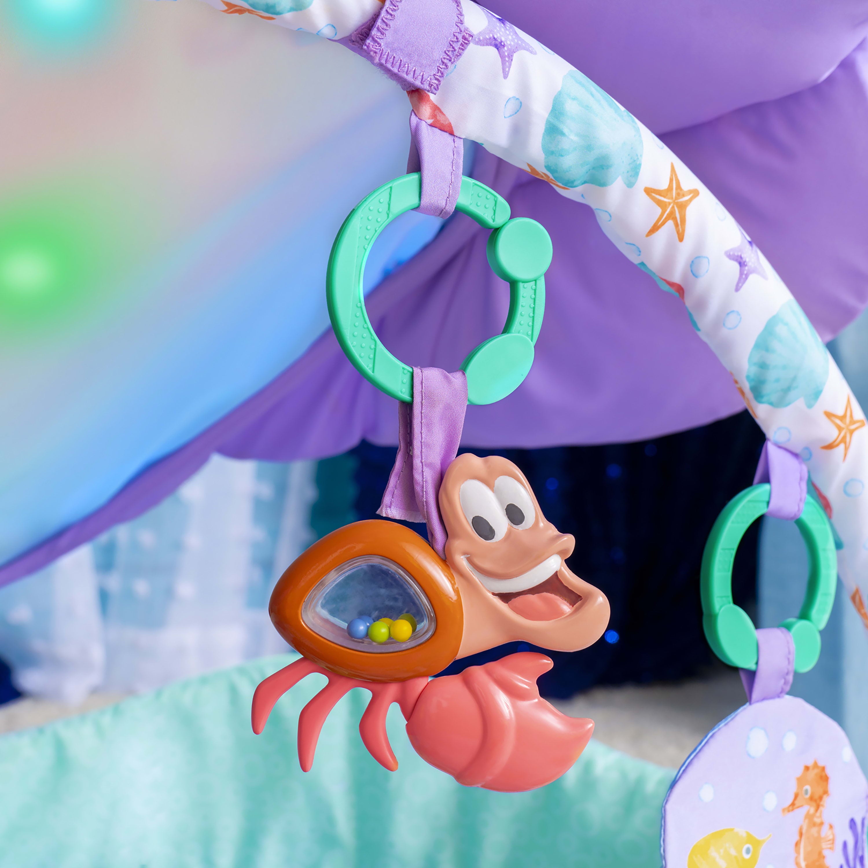 Bright Starts The Little Mermaid Twinkle Trove Light-Up Musical Baby Activity Gym with Tummy Time Pillow， Newborn+