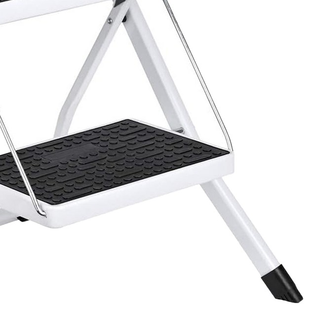 Delxo Portable Collapsible Lightweight Alloy Steel 2 Step Mini Stool Stepladder With Anti Slip Carry Hand Grip And Wide Pedal For Indoor Use White