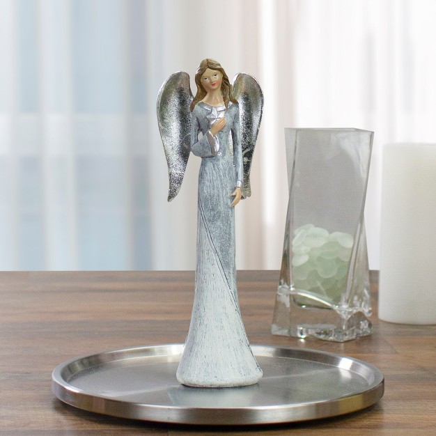 Gray And White Angel Figure Holding A Star