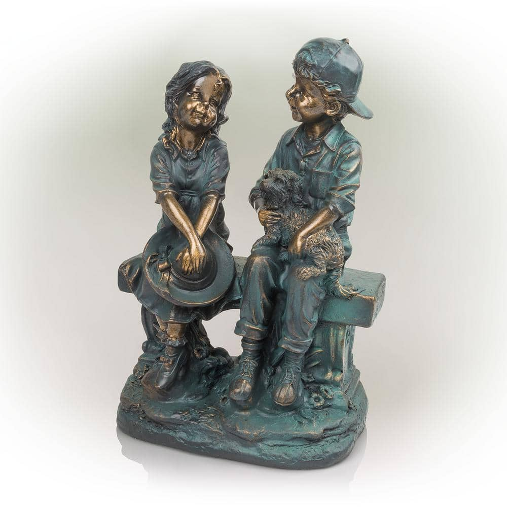 Alpine Corporation 16 in. Tall Indoor/Outdoor Girl and Boy Sitting on Bench with Puppy Statue Yard Art Decoration GXT264