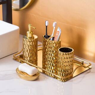 Dracelo 4-Piece Bathroom Accessory Set with Toothbrush Cup Soap Dispenser Soap Dish Tumbler in Gold B09YC7P61W