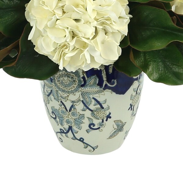 Hydrangea and Magnolia Leaf Arrangement in a Decorative Vase