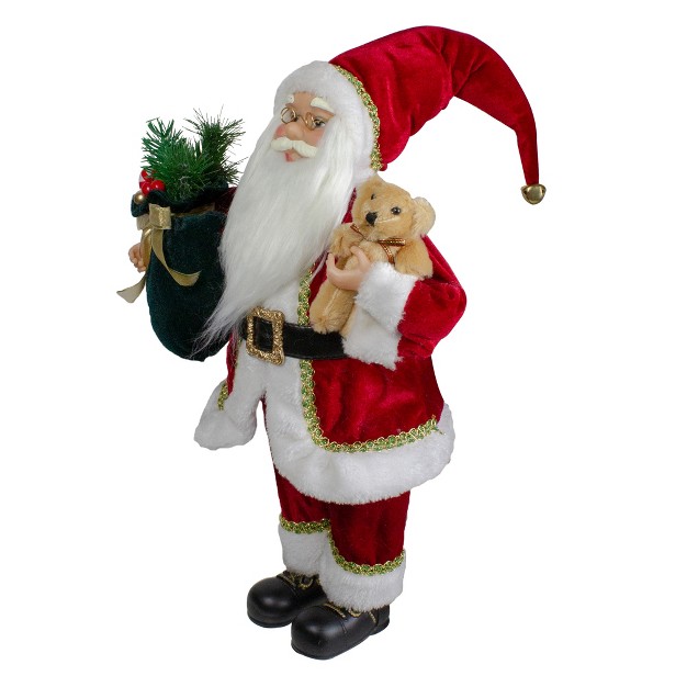 Standing Santa Christmas Figure With A Plush Bear