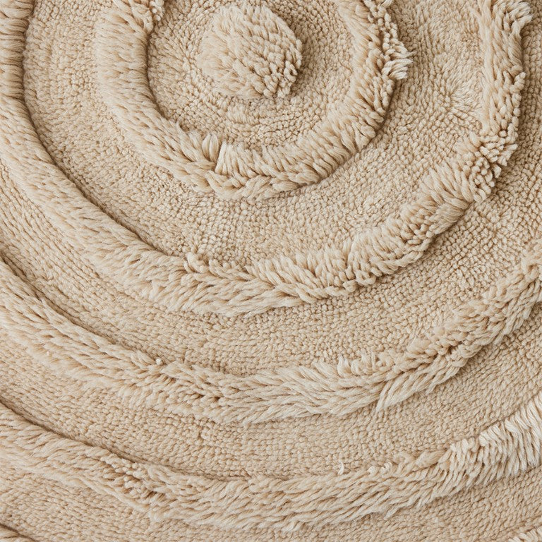 Round woolen rug cream