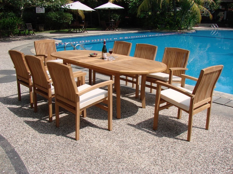 9 Piece Outdoor Teak Dining Set  117 quotOval Table  8 Wave Stacking Arm Chairs   Traditional   Outdoor Dining Sets   by Teak Deals  Houzz