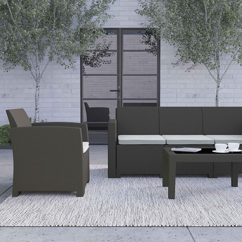 Merrick Lane Greta 4 Piece Faux Rattan Patio Furniture Set with Included Cushions， Chair， Sofa， Loveseat and Coffee Table