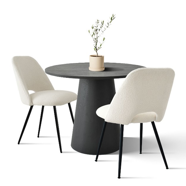 Black Round Concrete Dining Table And 2 Upholstered Boucle Chairs the Pop Maison