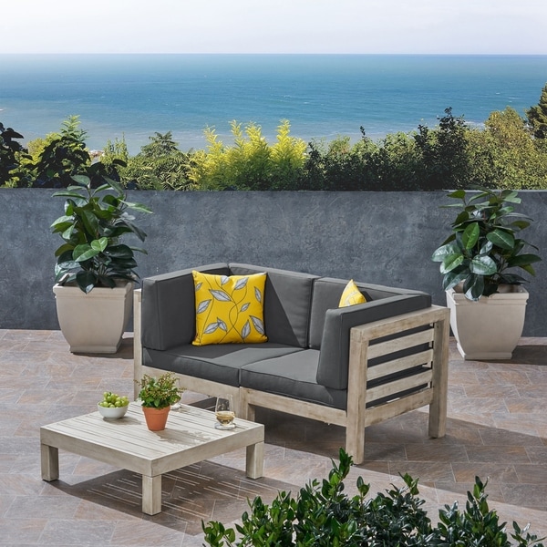 Oana Outdoor 2Seater Acacia Wood Sectional Loveseat Set with Coffee Table by Christopher Knight Home