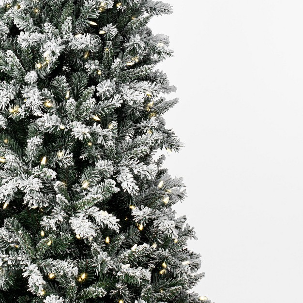 Frosted Glacier Pine Artificial Christmas Tree With Warm White Mini Lights.