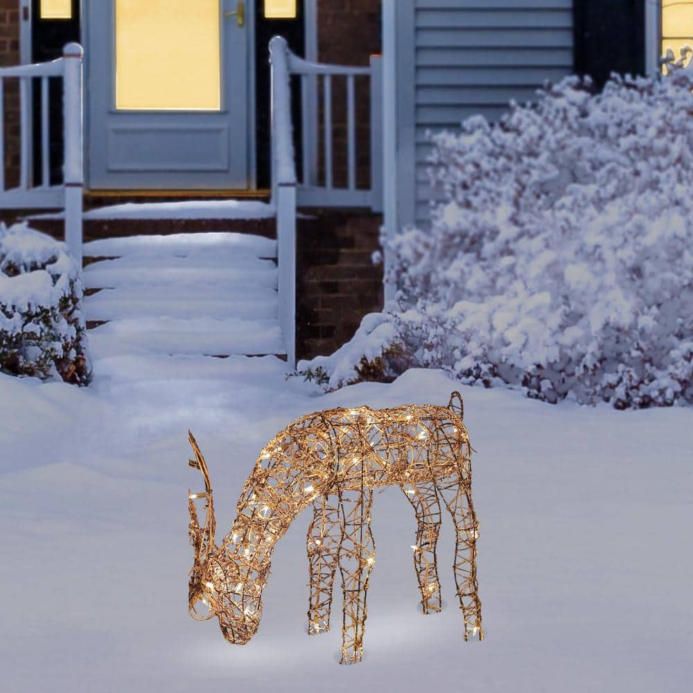 Alpine Corporation 24 in. Tall Rattan Grazing Reindeer Decoration with Halogen Lights AUH166