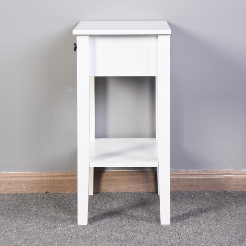 The white bathroom floor to ceiling storage table has a drawer