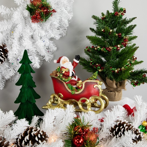 Red And Gold Waving Santa Sitting In A Sleigh Christmas Decoration