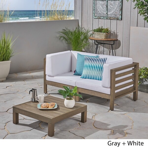 Oana Outdoor 2Seater Acacia Wood Sectional Loveseat and Coffee Table Set with Cushions by Christopher Knight Home