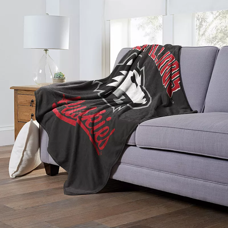 The Northwest Northern Illinois Huskies Alumni Silk-Touch Throw Blanket