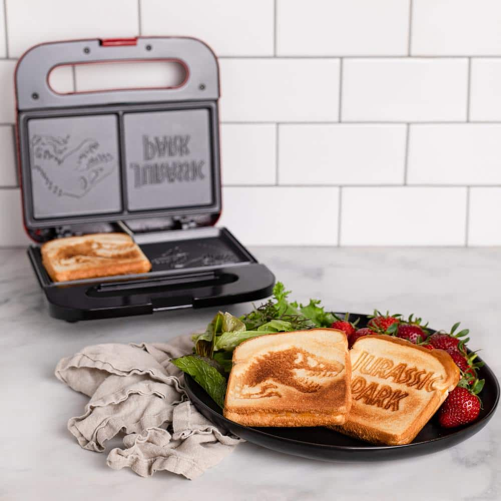 Uncanny Brands Red 900W Jurassic Park Grilled Grilled Cheese Sandwich Maker PP-JUR-JP