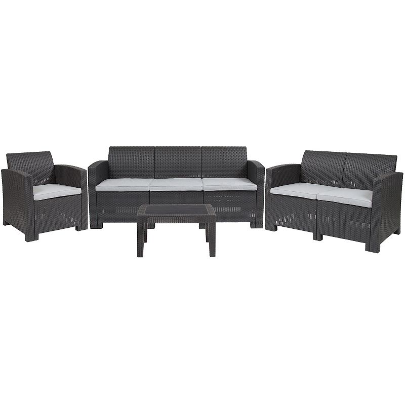 Merrick Lane Greta 4 Piece Faux Rattan Patio Furniture Set with Included Cushions， Chair， Sofa， Loveseat and Coffee Table