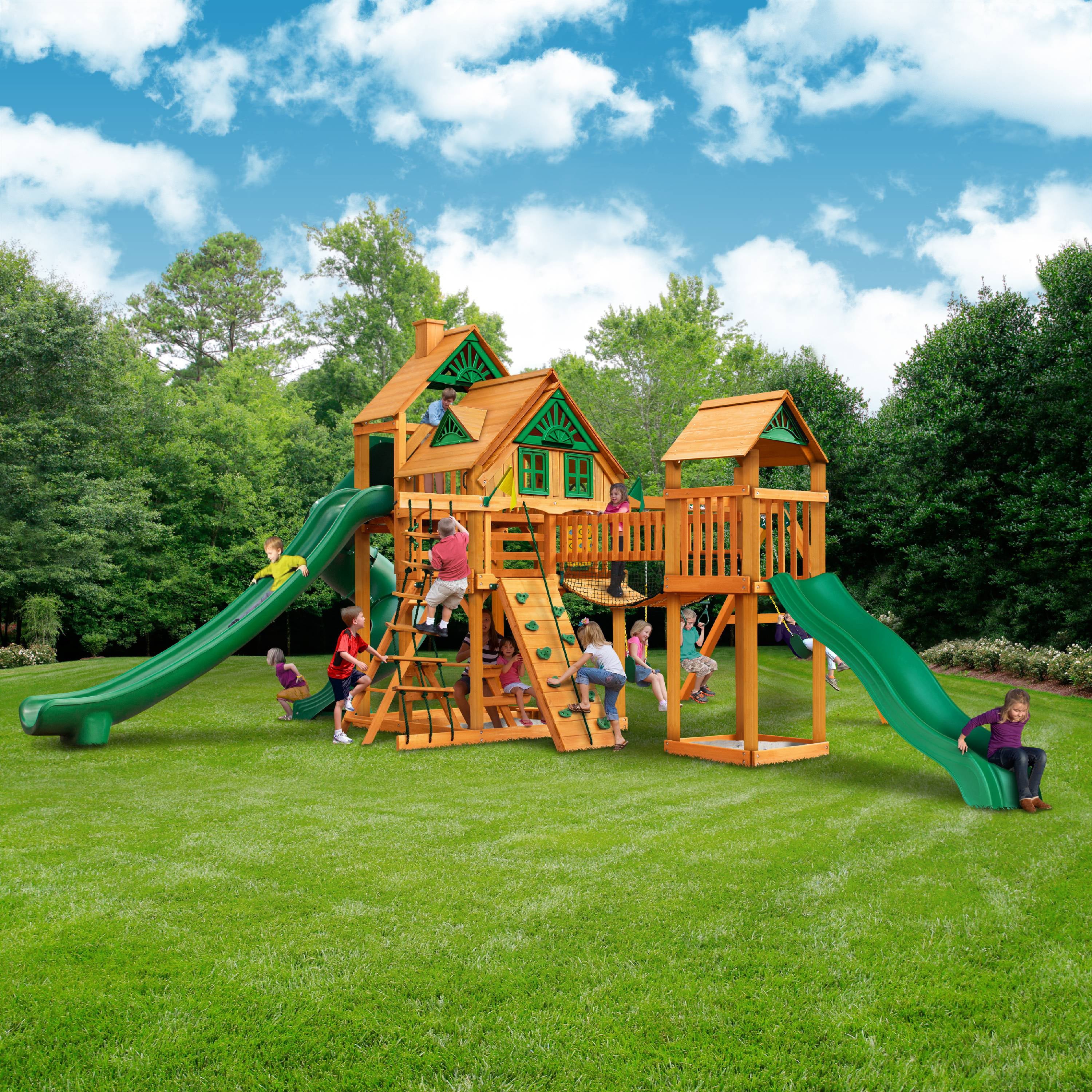 Gorilla Playsets Treasure Trove II Treehouse Wooden Swing Set with 3 Slides， Clatter Bridge and Tower， and Rock Climbing Wall