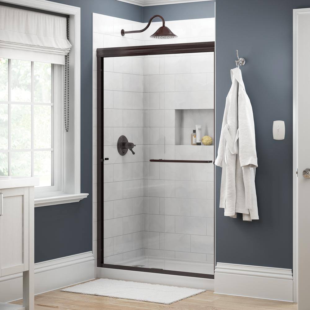 Delta Simplicity 48 in. x 70 in. Semi-Frameless Traditional Sliding Shower Door in Bronze with Clear Glass 2421840