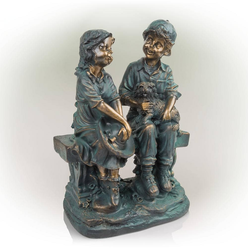 Alpine Corporation 16 in. Tall Indoor/Outdoor Girl and Boy Sitting on Bench with Puppy Statue Yard Art Decoration GXT264