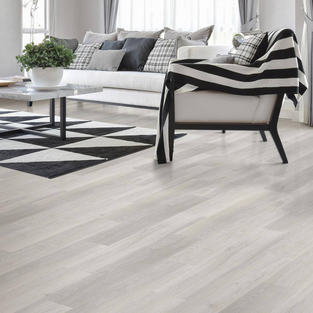 TrafficMaster Sandpiper Oak 4 MIL x 6 in. W x 36 in. L Grip Strip Water Resistant Luxury Vinyl Plank Flooring (24 sqftcase) 03919