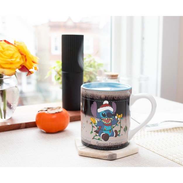 Silver Buffalo Disney Lilo amp Stitch Holiday Sweater Heat reveal Ceramic Mug Holds 14 Ounces