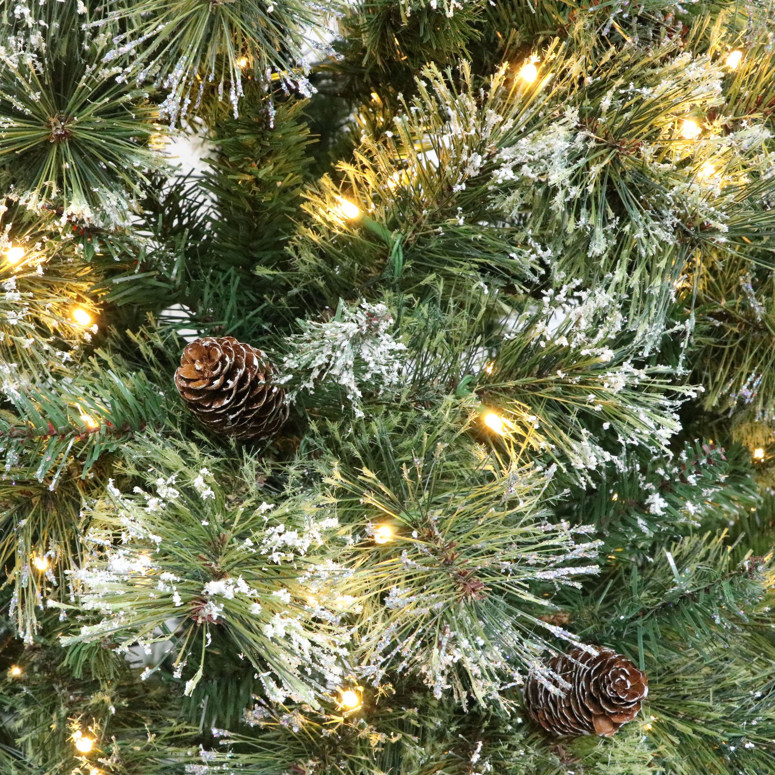 7-foot Cashmere Pine and Mixed Needles Pre-Lit Clear LED Hinged Artificial Christmas Tree with Snow and Glitter Branches and Frosted Pinecones