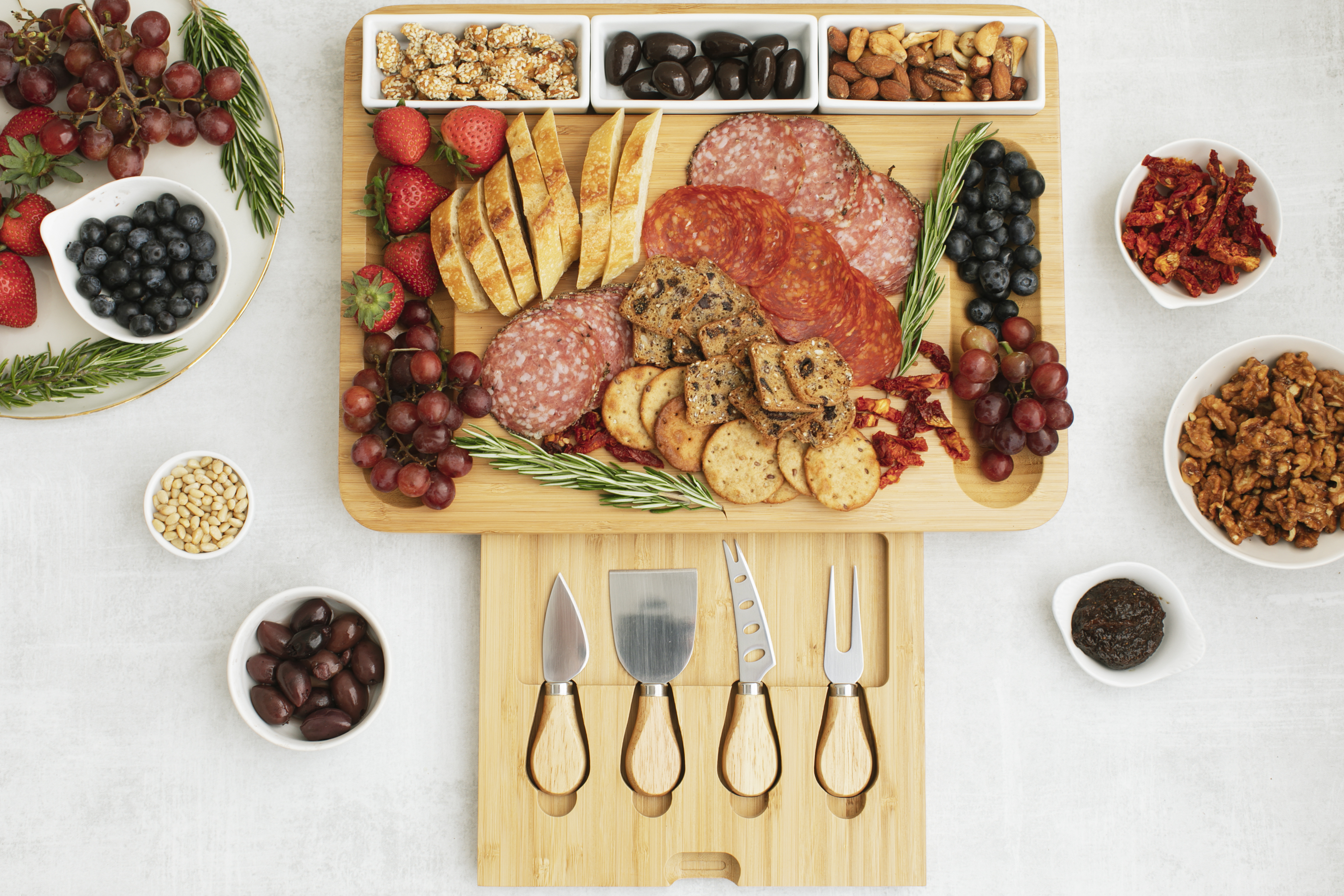 Natural Bamboo Cheese Board and Cutlery Set with Rectangular Ceramic Ramekins.