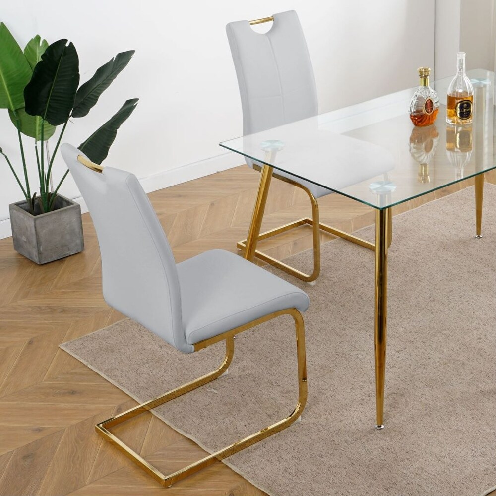 Modern Dining Chairs with Faux Leather Padded Seat and gold Metal Legs Set of 4