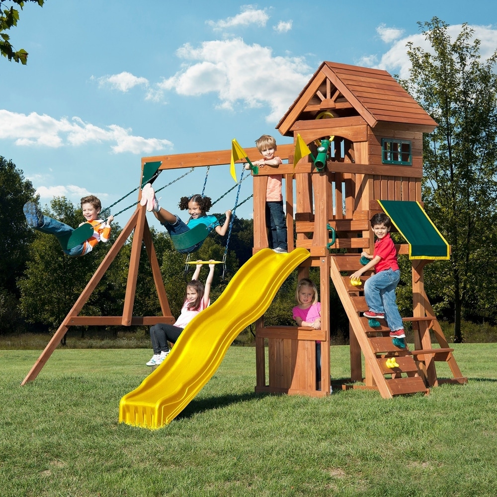 Swing N Slide Jamboree Fort Wooden Swing Set w/ Rock Wall  Picnic Table and Awning   13' W x 13' L x 9' 6\