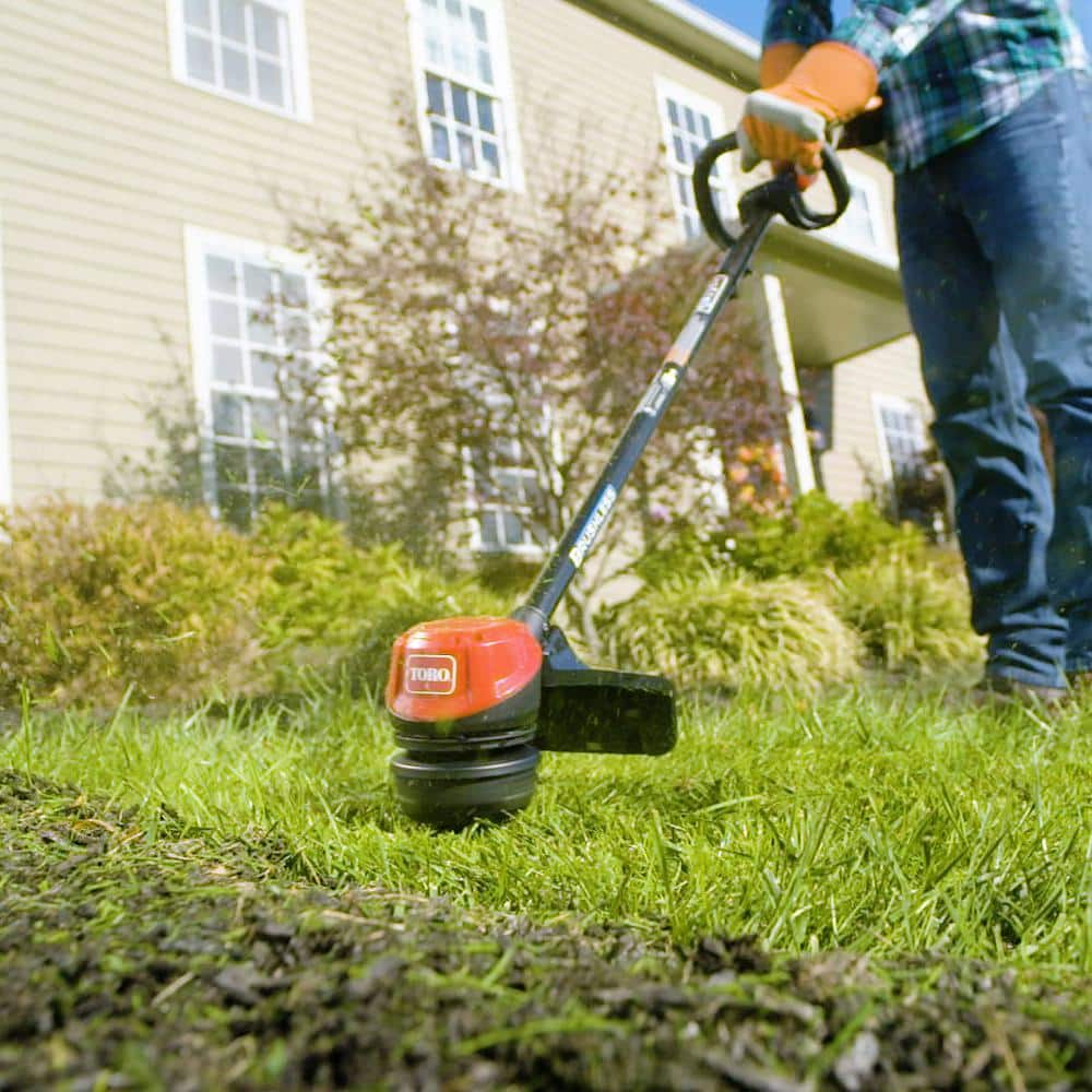 Toro 60V Max Lithium-Ion Brushless Cordless 15 in. / 13 in. String Trimmer - 2.0 Ah Battery and Charger Included 51831