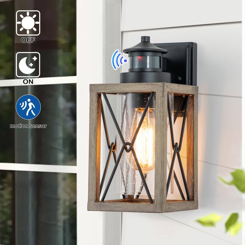 C Cattleya 1-Light Black and Faux Wood Motion Sensing Dusk to Dawn Outdoor Wall Lantern Sconce with Clear Seeded Glass CA2200-W