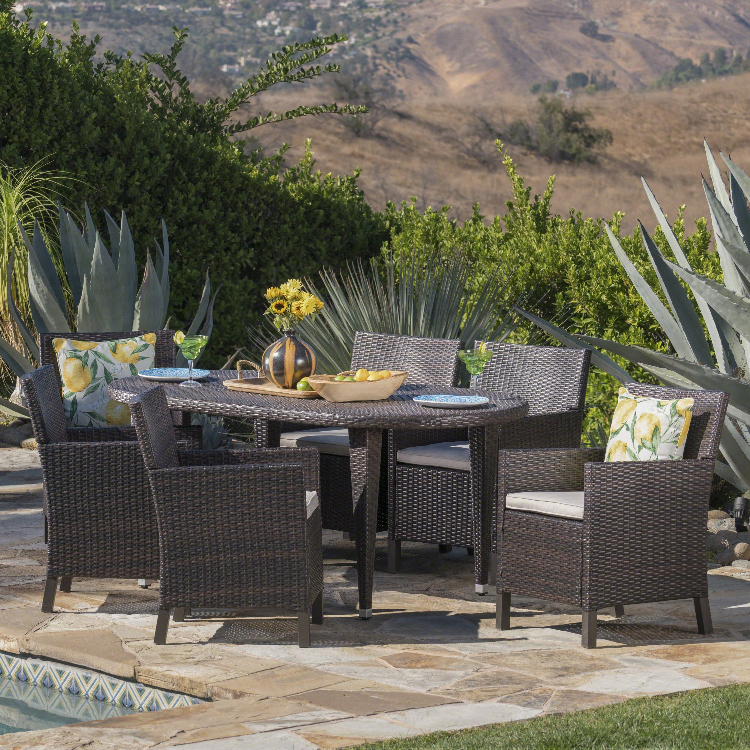 Crete Outdoor 7 Piece Wicker Oval Dining Set with Water Resistant Cushions